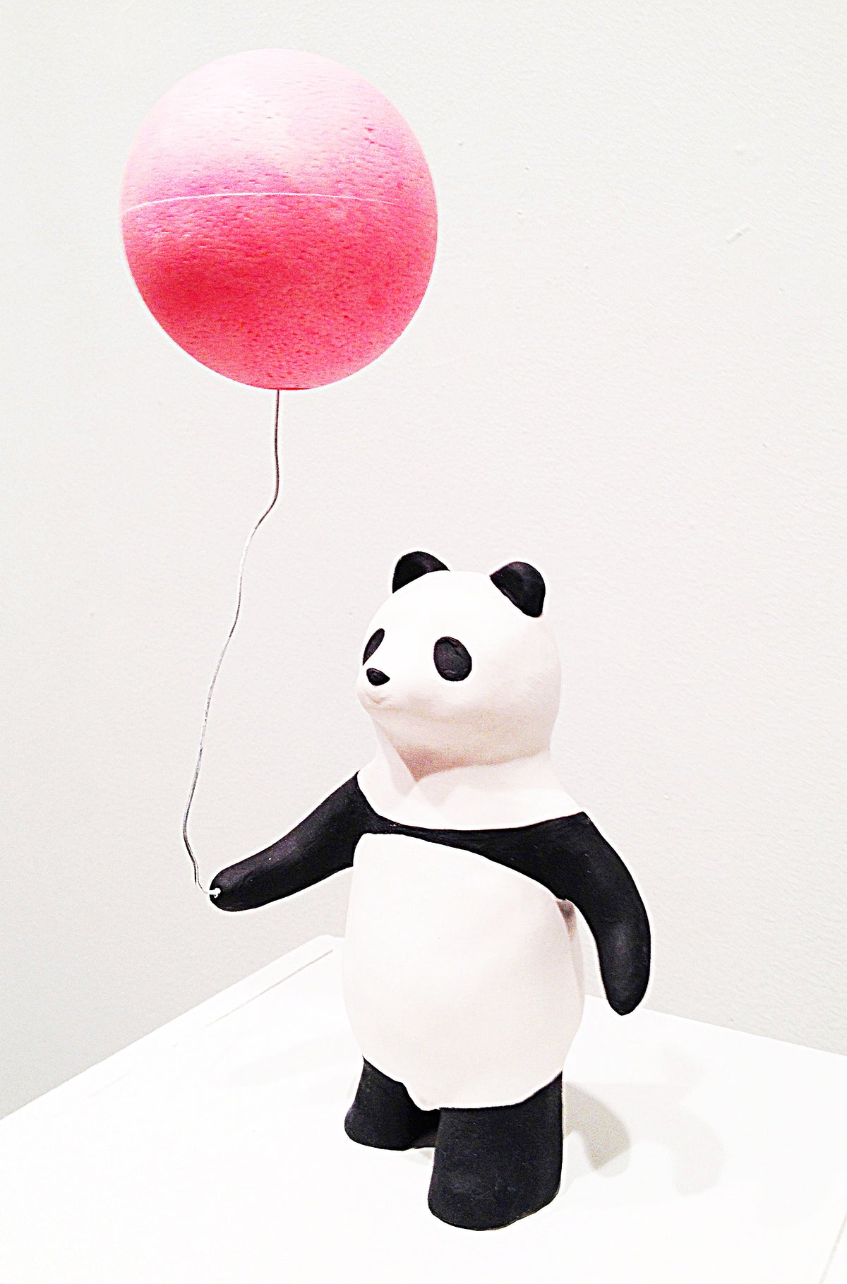 Panda and pink ball, ceramic artwork