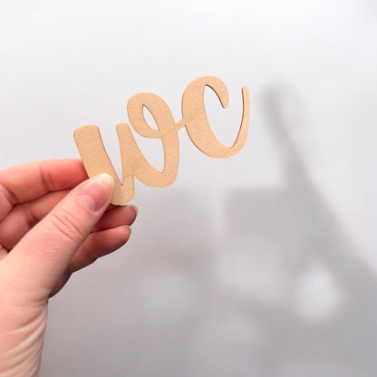 toilet sign, wood-colored